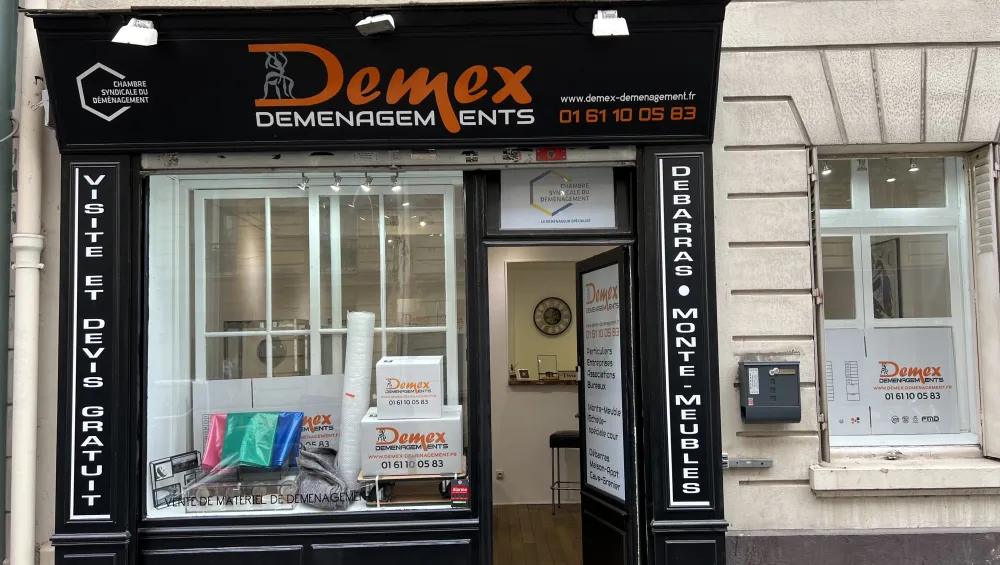 Boutique DEMEX Déménagement Paris 17, 3 rue du Débarcadère : devanture noire et orange, visite et devis gratuit